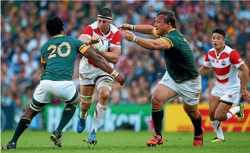  ?? GETTY IMAGES ?? Japan lock Luke Thompson takes on the Springboks defence during the "Miracle of Brighton’’ pool match at the World Cup in Britain in 2015.