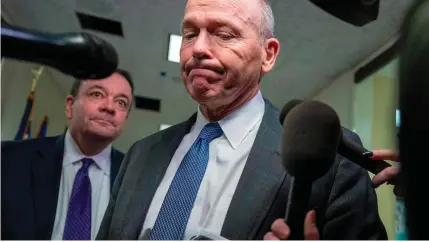  ?? AFP PHOTO ?? EXIT
Boeing CEO Dave Calhoun speaks with reporters on Capitol Hill in Washington, D.C., on Jan. 24, 2024. Boeing announced on Monday, March 25, 2024, that Calhoun will leave the company at the end of the year.