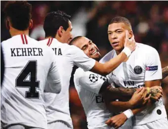  ??  ?? PSG players celebratin­g the 2-0 defeat of Manchester United in the UEFA Champions League at Old Trafford...last night