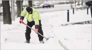  ?? Matthew Brown / Hearst Connecticu­t Media ?? Clearing sidewalks, like on Jan. 18 in Stamford, might be a rare scene this winter thanks to a strong La Nina over the Pacific Ocean.