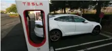  ?? SAM MIRCOVICH/REUTERS ?? Tesla is lobbying gas stations and hotels to install chargers for its cars.