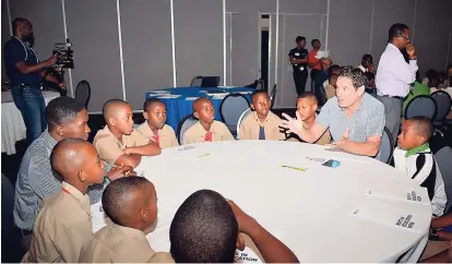  ??  ?? Repeat mentor Greg Purkiss had this group of boys fully engaged.