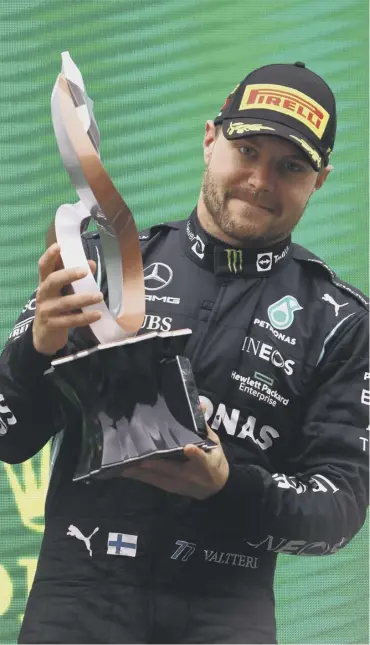  ?? ?? 0 Valtteri Bottas celebrates on the podium after winning the Turkish GP ahead of Max Verstappen
