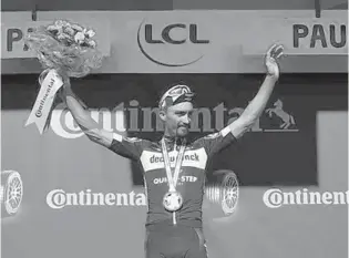  ?? JEFF PACHOUD/GETTY ?? France’s Julian Alaphilipp­e celebrates after winning the 13th stage of the Tour de France Friday.