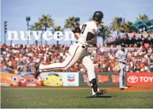  ?? Michael Macor / The Chronicle ?? Evan Longoria watches his two-run homer in the seventh inning. It was his first hit with the Giants in 18 at-bats.