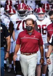  ?? (AP/L.G. Patterson) ?? Alabama Coach Nick Saban, who announced Wednesday he has tested positive for covid-19, said he will continue his game preparatio­ns, albeit from home. “I didn’t leave the country or anything,” he said. “I’m just right down the street.”