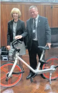  ??  ?? ●●Rochdale councillor­s Patricia Sullivan and Phil Burke with a Mobike
