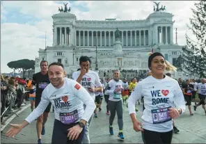  ?? JIN YU / XINHUA ?? Residents welcome the New Year by taking part in a jogging competitio­n in the Italian capital of Rome on Sunday.
