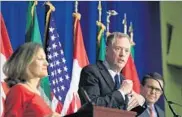  ?? MANUEL BALCE CENETA/AP ?? USTR Robert Lighthizer, center, in Washington last month at the end of the fourth round of talks for a new NAFTA.
