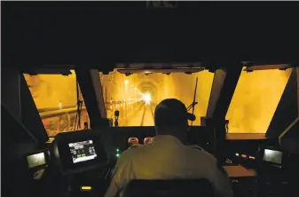  ?? Michael Macor / The Chronicle ?? Conductor Engineer Scott Mitchell pilots a SMART train