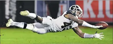  ?? Wally Skalij Los Angeles Times ?? RAMS SAFETY John Johnson fails to make this intercepti­on but he does have four this season, tied for sixth-most in the league. “He can do so much. He’s just an all-around good player,” teammate Aqib Talib says.
