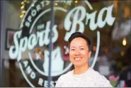  ?? PHOTO: AP ?? The Sports Bra founder and CEO Jenny Nguyen poses for a photograph outside the sports bar in Portland, Oregon, on Thursday.