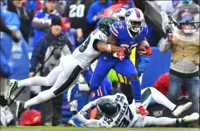  ?? ADRIAN KRAUS - THE ASSOCIATED PRESS ?? Buffalo Bills’ Devin Singletary (26), center, breaks tackles to score a touchdown during the second half of an NFL football game against the Philadelph­ia Eagles, Sunday, Oct. 27, 2019, in Orchard Park, N.Y.