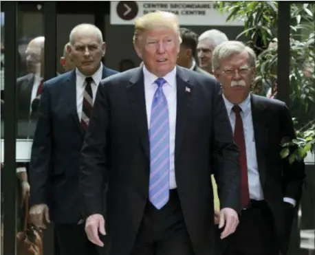  ?? SEAN KILPATRICK/THE CANADIAN PRESS VIA AP ?? U.S. President Donald Trump leaves the G7 Leaders Summit in La Malbaie, Que., on Saturday, June 9, 2018., with White House Chief of Staff John Kelly, left, and National Security Adviser John Bolton.