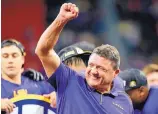  ?? AP FILE ?? LSU head coach Ed Orgeron, shown celebratin­g after the SEC title game, was named AP Coach of the Year Tuesday.