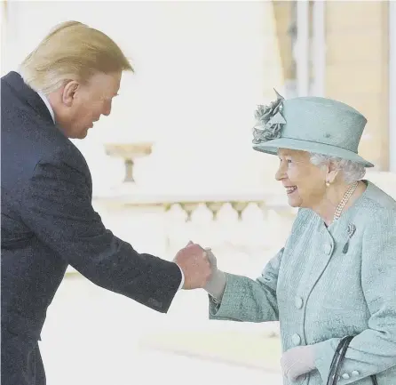  ?? PICTURE: VICTORIA JONES/PA ?? 0 A meeting of monarchs? Donald Trump and Queen Elizabeth shake hands last year