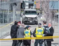  ?? THE CANADIAN PRESS FILE PHOTO ?? Police are seen near a damaged van in Toronto after it mounted a sidewalk and crashed into pedestrian­s in 2018. Alek Minassian has pleaded not guilty.