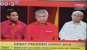  ?? PIC BY NUR ADIBAH AHMAD IZAM ?? A screenshot of Umno presidenti­al candidates (from left) Khairy Jamaluddin, Datuk Seri Dr Ahmad Zahid Hamidi and Tengku Razaleigh Hamzah during the Umno presidenti­al debate on Astro Awani yesterday.