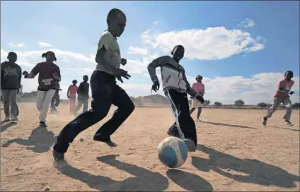  ?? Photos: Monirul Bhuiyan/AFP and Oupa Nkosi ?? Solutions: More football (above) in township schools would lead to a better national team and more internatio­nal sporting events like the 2010 World Cup (below) would inspire us all.