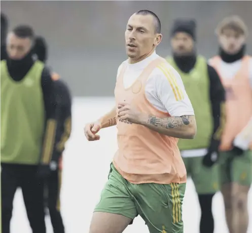  ??  ?? 0 Scott Brown training at Lennoxtown yesterday after returning from self-isolation following Celtic’s controvers­ial trip to Dubai