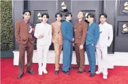  ?? JORDAN STRAUSS/INVISION ?? The members of BTS arrive at the Grammys April 3 in Las Vegas.