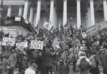  ?? KENT NISHIMURA Los Angeles Times/TNS ?? Protesters at the U.S. Capitol on Jan. 6, 2021, halted a joint session of Congress that was being held to certify Joe Biden as the winner of the 2020 presidenti­al election. Charges against about 300 people who were there include obstructio­n.