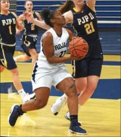  ?? AUSTIN HERTZOG - DIGITAL FIRST MEDIA ?? Pottstown’s Ebony Reddick, pictured last season against Pope John Paul II, had 17 points and 10 rebounds in the Trojans’ non-league win over Kutztown Friday.