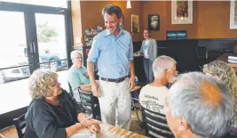  ?? Daniel Brenner, Special to The Denver Post ?? U.S. Senate candidate Andrew Romanoff speaks with supporters July 31 at Navah Coffee House in Westminste­r.