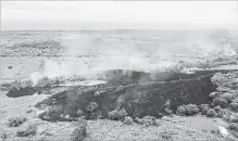  ?? HANDOUT GETTY IMAGES ?? In this photo provided by the U.S. Geological Survey, a lava flow emerges from a fissure due to Kilauea volcano activity on Hawaii's Big Island.