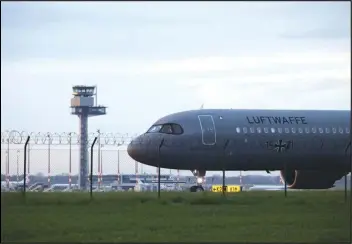  ?? ASSOCIATED PRESS ?? An Air Force Airbus carrying German citizens evacuated from Sudan lands Monday at Berlin Brandenbur­g Airport in Schonefeld, Germany.