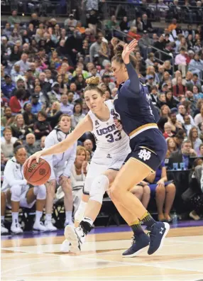  ??  ?? Connecticu­t guard/forward Katie Lou Samuelson drives against Notre Dame guard Marina Mabrey in the semifinals of the women’s Final Four last season in Columbus, Ohio. AARON DOSTER/USA TODAY SPORTS