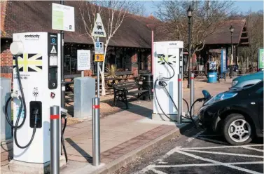  ?? ALAMY. ?? An electric car charging point at Maidstone Services on the M20 motorway. Tim Naylor says electric cars will require charging so often that rail services (electrifie­d) will provide a better and more effective option.