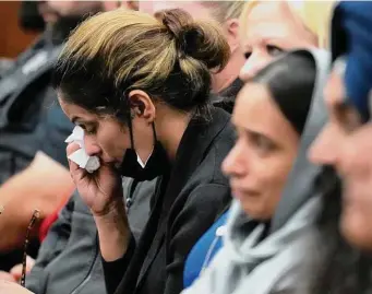  ?? Photos by Melissa Phillip/Staff photograph­er ?? Harwinder Kaur Dhaliwal, widow of Deputy Sandeep Dhaliwal, wipes her tears during closing statements in the punishment phrase Wednesday of Robert Solis’ trial.