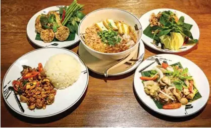  ??  ?? Vegetarian versions of various Thai dishes made with meat substitute­s at a restaurant in Bangkok.