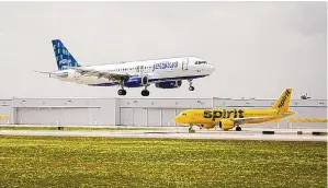  ?? EVA MARIE UZCATEGUI/BLOOMBERG ?? JetBlue Airways and Spirit Airlines both fly out of Fort Lauderdale-Hollywood Internatio­nal Airport in Florida. JetBlue and Frontier Airlines are in a bidding war to take over Spirit.