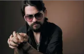  ?? PHOTO BY CHRIS PIZZELLO — INVISION — AP Photos and text from wire services ?? In this photo, singer-songwriter Shooter Jennings, son of iconic country musicians, Waylon Jennings and Jessi Colter, poses for a portrait in Los Angeles.