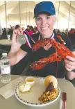  ??  ?? Joanne Elves savours a lobster dinner after completing the ride.