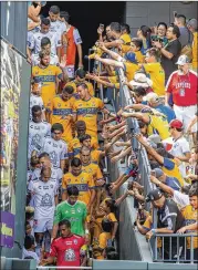  ?? STEPHEN SPILLMAN / FOR AMERICAN-STATESMAN ?? Players for Tigres UANL and Pachuca take the field before Sunday’s game in Round Rock. “The stadium, the fans, it was all good and hopefully we come back soon,” said Jürgen Damm of Tigres.