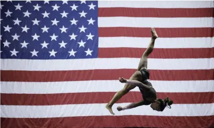  ??  ?? Simone Biles competes in the beam during the senior women’s competitio­n at the US gymnastics championsh­ips on Sunday. Photograph: Charlie Riedel/AP