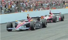  ?? AJ MAST, THE INDIANAPOL­IS STAR ?? Danica Patrick, left, passes Dan Wheldon on a restart during the Indy 500 in 2005, when she finished in fourth place.