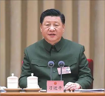  ?? LI GANG / XINHUA ?? President Xi Jinping, who is also general secretary of the Communist Party of China Central Committee and chairman of the Central Military Commission, addresses a plenary meeting in Beijing of the delegation of the People’s Liberation Army and People’s Armed Police Force, at the fifth session of the 13th National People’s Congress, China’s top legislatur­e, on March 7.