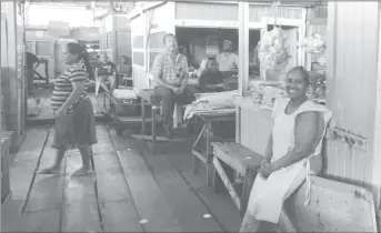  ??  ?? Vendors operating on Friday at the decrepit Stabroek Wharf.