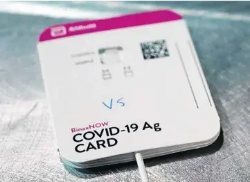  ?? TED S WARREN/AP ?? The BinaxNOW rapid COVID-19 test is made by Abbott Laboratori­es. At-home tests can be purchased over the counter, and in some cases, give results in a matter of minutes.