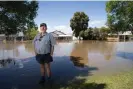  ?? Photograph: Mike Bowers/The Guardian ?? John Shaw in front of his flooded house in Forbes on Thursday.