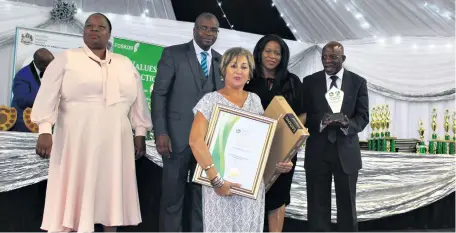  ?? Kutami Thando Ndlovu ?? St Catherine’s Principal Vanessa Janse van Rensburg (front) received the award for best performing school. At the back are King Cetshwayo District Mayor Nonhle Mkhulisi, Education Director David Chonco, MP Nomalungel­o Gina and Prof Silo