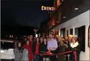  ?? SUBMITTED PHOTOS ?? Keith Kopicki (center) surroundin­g by friends, family, board members and staff out front of Grind in Boyertown.