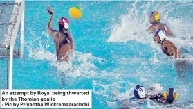  ??  ?? An attempt by Royal being thwarted by the Thomian goalie- Pic by Priyantha Wickramaar­achchi