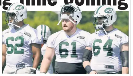  ?? Bill Kostroun ?? NEW KID ON THE BLOCK: The Jets added former Redskin Spencer Long (61), at an OTA practice with fellow linemen Antonio Garcia and Travis Swanson (64), in an effort to improve their poor performanc­e last season.