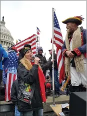  ?? THE ASSOCIATED PRESS ?? Republican Women’s Federation of Michigan Vice President Londa Gatt stands with others outside the Capitol building in Washington on Jan. 6.