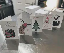  ??  ?? Jessica designed Christmas cards t o sell.